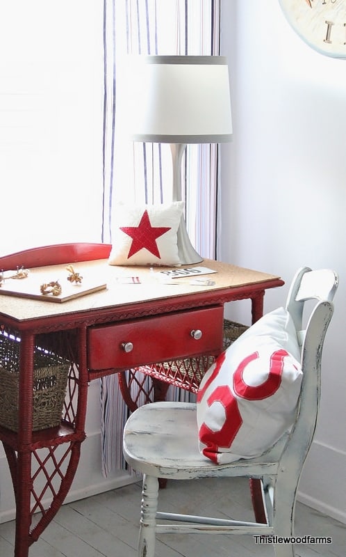 Cozy and patriotic corner desk setup with cork topped desk and star-themed accents in a bright room.