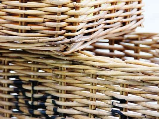 A close-up of stacked woven wicker baskets showcasing the intricate texture and craftsmanship.
