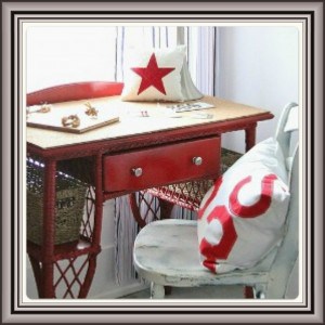 Image (1) A cozy workspace corner with a vintage red and white writing desk paired with a white chair adorned with star-patterned cushions.